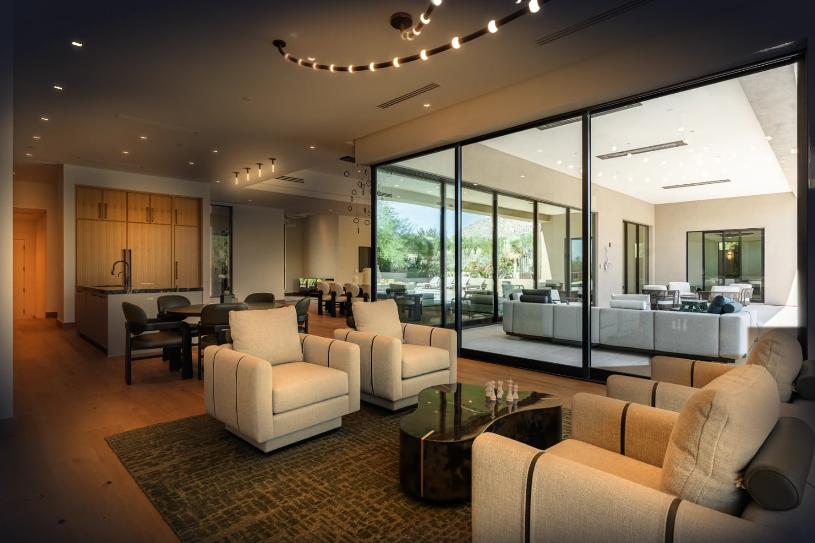 Phoenix interior designers great room Fully lit great room by Phoenix interior designers, opening to a covered patio and the Arizona desert